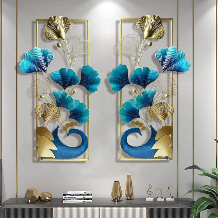 A set of two vertical frame metal wall art featuring a peacock and leaves with a gold and multicolor design.