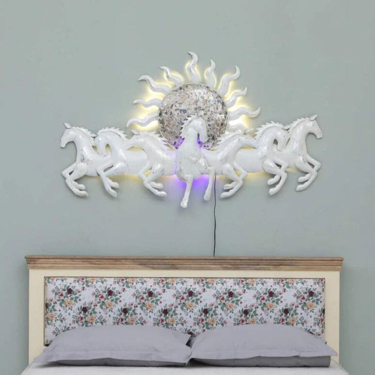 Bring the sun and the wild to your living room with this 48" wall art. Featuring seven beautiful white horses and a striking sun, this piece is sure to bring excitement and life to any space. Gallop into your dream living room with this stunning piece of art. Size: 48 x 27 Inches. Made of High-Quality Iron Metal Anti-rust powder coating used for long lasting finish Hanging Mechanism included Horse wall decor with led lighting