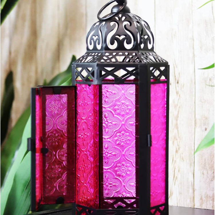 Vintage Moroccan Style Lantern with Pink Glass Panels, 11.5 Inch-Hansart-Hansart, Add a touch of exotic charm and vibrant color to your space with this stunning Moroccan Style Lantern. Featuring intricate metalwork and beautiful pink embossed glass panels, this lantern casts a warm, enchanting glow. Perfect for both indoor and outdoor settings, it’s ideal for creating a cozy ambiance during parties, romantic dinners, or quiet evenings on the patio. The hinged door makes it easy to place a candle inside, and
