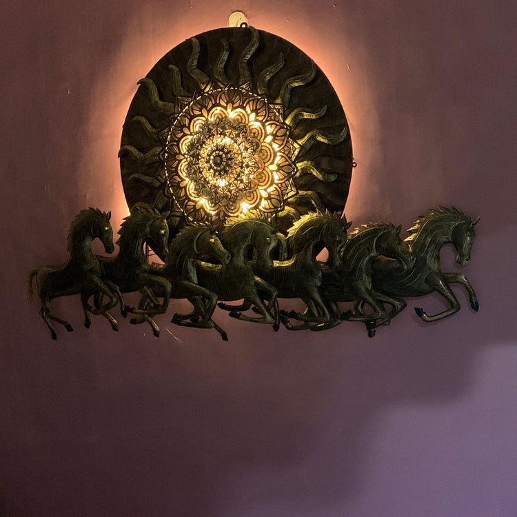 96 Inches Antique 7 Horses with Sun Metal Wall Art for Living Room. HANSART. This stunning 96 x 48 Inches (8 x 4 ft.) metal wall art features an intricate design of seven galloping horses, symbolizing strength, success, and prosperity, along with a radiant sun in the background. Crafted with a combination of antique gold and green shades, this piece is an elegant addition to any home or office decor. The detailed carving and textured finish give it a luxurious and traditional aesthetic.