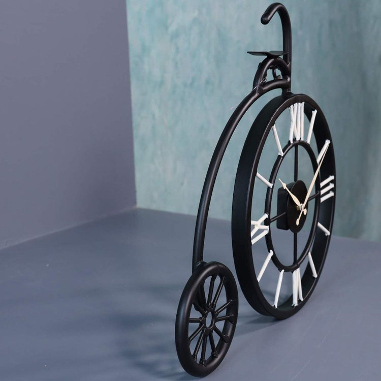This Vintage Wheel Metal Wall Clock is the perfect addition to any living room. Crafted with durable metal, it features a vintage wheel design that adds a touch of unique charm to any space. Keep track of time in style while adding a touch of retro appeal to your home decor.