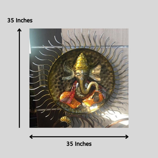 Enhance your home décor with this exquisite Handcrafted Metal Wall Hanging of Lord Ganesha with Sun Design. This beautiful artwork symbolizes positivity, wisdom, and prosperity, making it a perfect addition to your living space, pooja room, or office. The intricate detailing, vibrant colors, and stunning sunburst frame add a divine aura, making it a great gift for festive occasions, housewarmings, and spiritual celebrations. 35 X 35 Inches