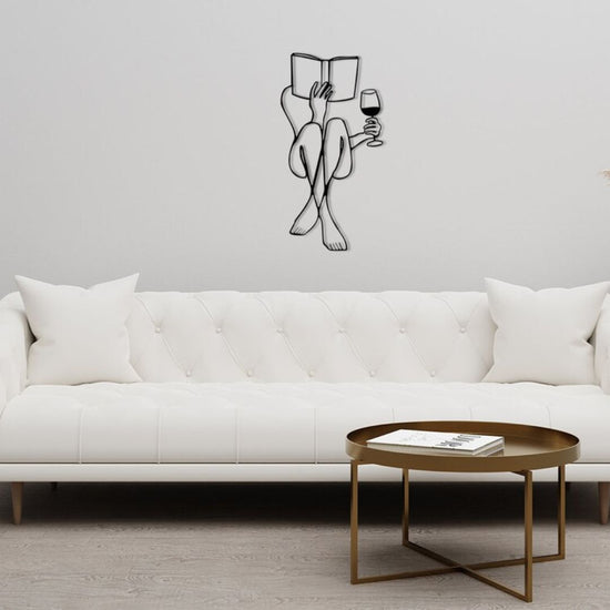 Elevate your home deThis stunning piece features a woman holding a glass of wine, adding a touch of sophistication and elegance to any room. Crafted with metal, it is both durable and visually appealing. Unleash your inner art enthusiast and make a statement in your home to-Measures 22 x 33 Inches-Constructed of High Quality Metal-Anti-rust powder coating used for long lasting finish Hanging Mechanism included Perfect for your living room, bedroom, hall, office reception, guest room, and hotel reception