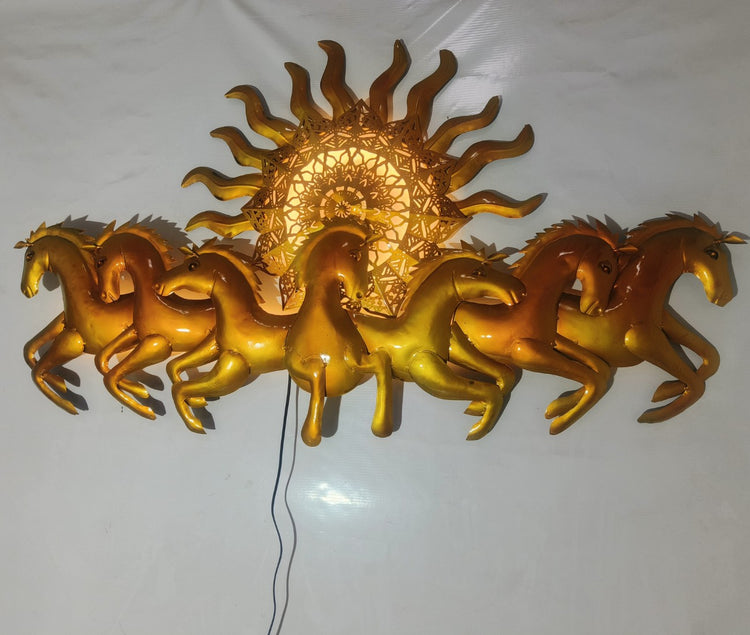 This Designer Gold metal wall art features a stunning depiction of 7 galloping horses against a warm sun backdrop. At 48 x 28 inches, it is sure to make a statement in any room. The integrated LED lights add a touch of modernity and ambiance. Perfect for any equestrian enthusiast. Size: 48 x 28 Inches. Made of High-Quality Iron Metal Anti-rust powder coating used for long lasting finish Hanging Mechanism included Horse wall decor with led lighting Perfect for your living room, bedroom, hall, office recept