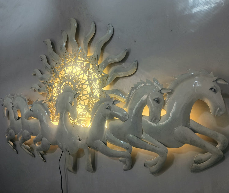 This Designer White metal wall art features a stunning depiction of 7 galloping horses against a warm sun backdrop. At 48 x 28 inches, it is sure to make a statement in any room. The integrated LED lights add a touch of modernity and ambiance. Perfect for any equestrian enthusiast. Size: 48 x 28 Inches. Made of High-Quality Iron Metal Anti-rust powder coating used for long lasting finish Hanging Mechanism included Horse wall decor with led lighting Perfect for your living room, bedroom, hall, office recep