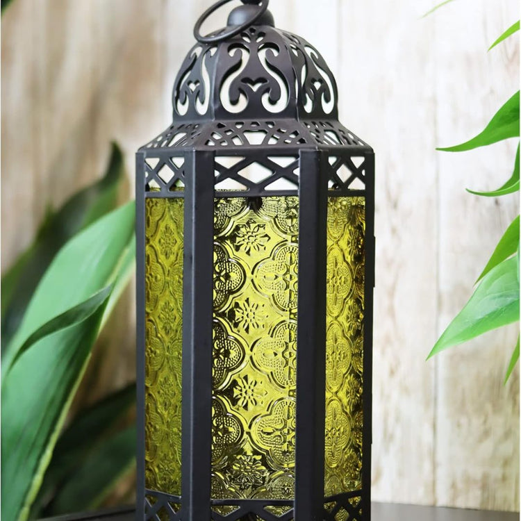 Vintage Moroccan Style Black Lantern with Yellow Glass Panels-Hansart-Hansart, Add a touch of exotic elegance to your home décor with this beautifully crafted Moroccan-style lantern. Featuring intricate cut-out patterns on a sturdy metal frame and vibrant yellow embossed glass panels, this lantern casts a warm, inviting glow when lit. Standing 11.5 inches tall, it’s perfect for tabletop centerpieces, hanging displays, or as a charming accent in both indoor and outdoor settings. Whether used with candles or