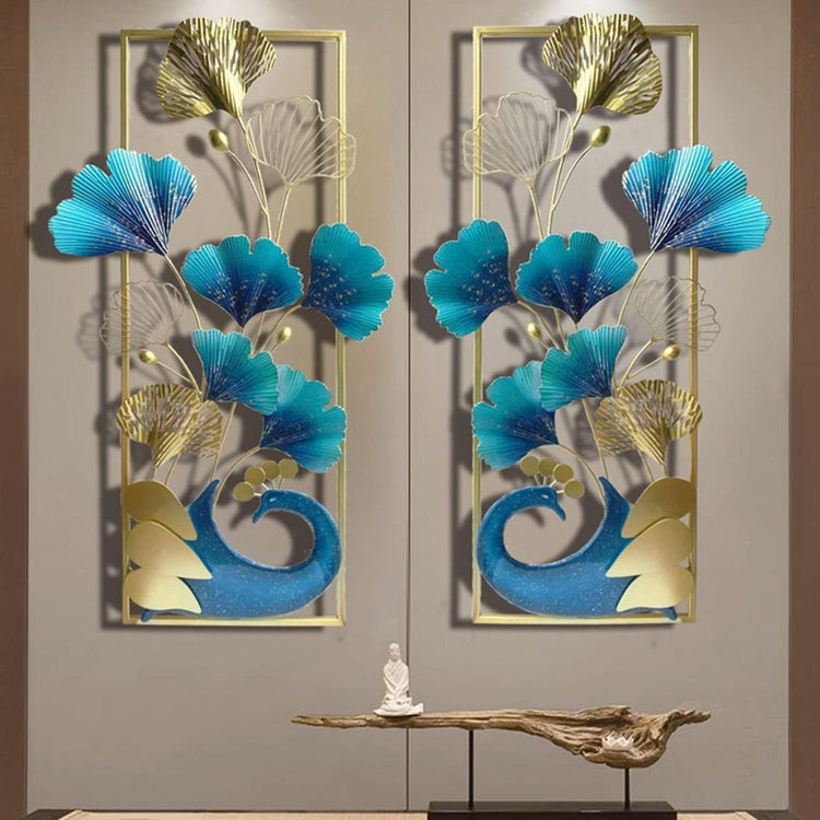 A set of two vertical frame metal wall art featuring a peacock and leaves with a gold and multicolor design.