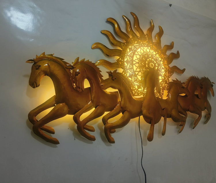 This Designer Gold metal wall art features a stunning depiction of 7 galloping horses against a warm sun backdrop. At 48 x 28 inches, it is sure to make a statement in any room. The integrated LED lights add a touch of modernity and ambiance. Perfect for any equestrian enthusiast. Size: 48 x 28 Inches. Made of High-Quality Iron Metal Anti-rust powder coating used for long lasting finish Hanging Mechanism included Horse wall decor with led lighting Perfect for your living room, bedroom, hall, office recept