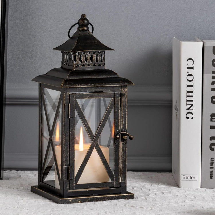 Vintage Black Candle Lantern Holder for Indoor Outdoor Decoration-Hansart-Hansart, Add a touch of vintage charm and warm ambiance to your space with this Rustic Black Metal Candle Lantern. Crafted from durable metal with clear glass panels, this lantern features an elegant cross-frame design and distressed finish, making it a perfect addition to both indoor and outdoor decor. Place a real or flameless LED candle inside to create a cozy glow on your patio, living room, garden, or during special events like w