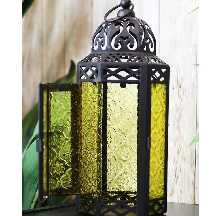 Vintage Moroccan Style Black Lantern with Yellow Glass Panels-Hansart-Hansart, Add a touch of exotic elegance to your home décor with this beautifully crafted Moroccan-style lantern. Featuring intricate cut-out patterns on a sturdy metal frame and vibrant yellow embossed glass panels, this lantern casts a warm, inviting glow when lit. Standing 11.5 inches tall, it’s perfect for tabletop centerpieces, hanging displays, or as a charming accent in both indoor and outdoor settings. Whether used with candles or