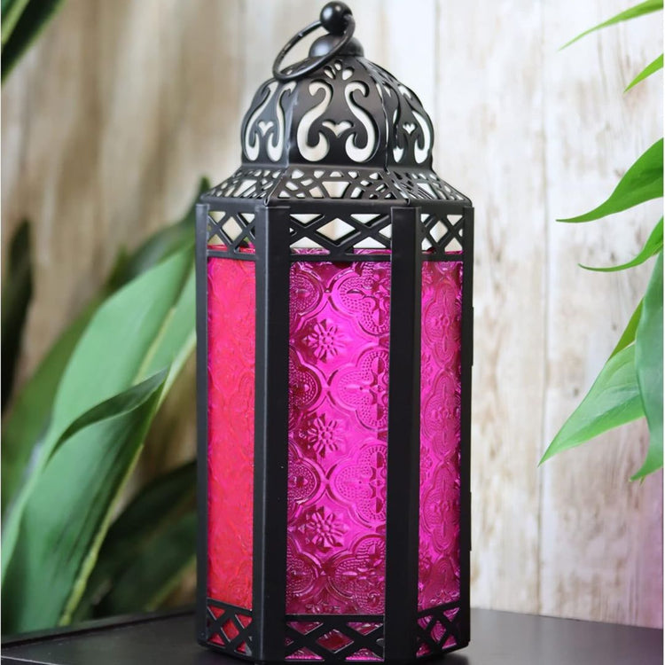Vintage Moroccan Style Lantern with Pink Glass Panels, 11.5 Inch-Hansart-Hansart, Add a touch of exotic charm and vibrant color to your space with this stunning Moroccan Style Lantern. Featuring intricate metalwork and beautiful pink embossed glass panels, this lantern casts a warm, enchanting glow. Perfect for both indoor and outdoor settings, it’s ideal for creating a cozy ambiance during parties, romantic dinners, or quiet evenings on the patio. The hinged door makes it easy to place a candle inside, and