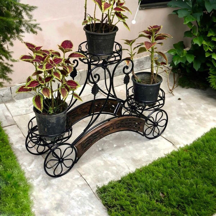 HANSART, Elevate your garden or patio decor with this Elegant Wrought Iron Multi-Tier Planter Stand, a perfect blend of classic design and modern functionality. Crafted from high-quality wrought iron, this stand features intricate scrollwork and floral accents, making it a striking addition to both indoor and outdoor spaces. The multi-tiered structure allows you to display a variety of plants, flowers, or decorative pots, enhancing the visual appeal of your space while optimizing your plant arrangement.