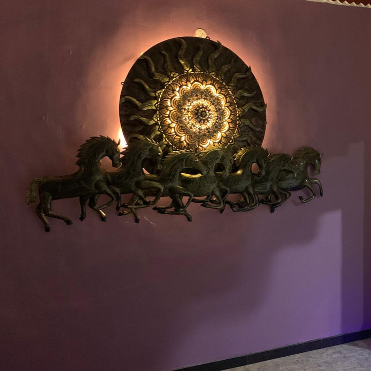 96 Inches Antique 7 Horses with Sun Metal Wall Art for Living Room. HANSART. This stunning 96 x 48 Inches (8 x 4 ft.) metal wall art features an intricate design of seven galloping horses, symbolizing strength, success, and prosperity, along with a radiant sun in the background. Crafted with a combination of antique gold and green shades, this piece is an elegant addition to any home or office decor. The detailed carving and textured finish give it a luxurious and traditional aesthetic.