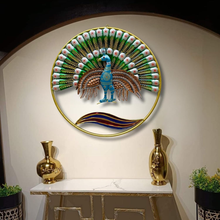 Decorative wall art of a peacock on a circular frame with gold trim, displayed above a console table.