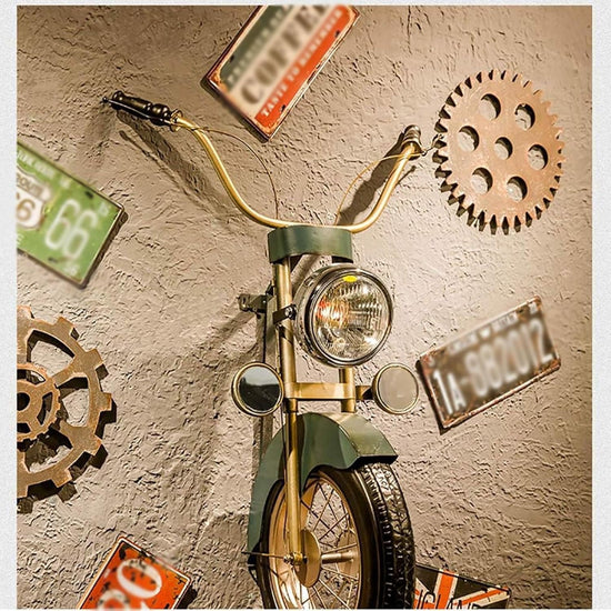 HANSART, Bring a bold and nostalgic touch to your space with this Vintage Motorcycle Front Wall Decor. Designed to replicate the front of a classic motorcycle, this unique wall art piece features realistic details including a metal handlebar, headlight, and tire. The industrial retro finish and authentic styling make it a perfect statement piece for garages, cafes, man caves, or any space in need of a rugged, adventurous vibe.