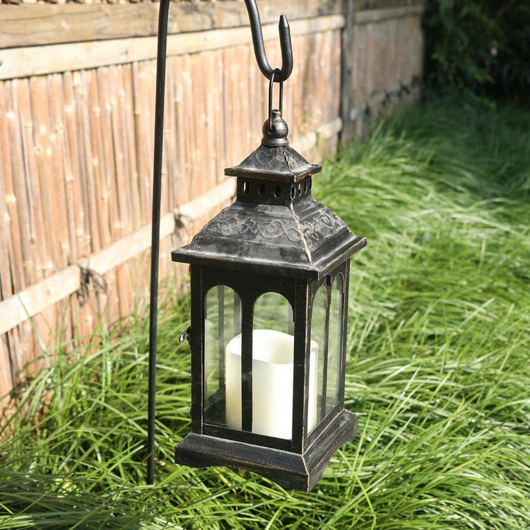 Vintage Black Metal Lantern Candle Holder for Home and Garden Decor-Hansart-Hansart, Add a touch of timeless elegance to your indoor or outdoor space with this Vintage Black Metal Lantern. Crafted from premium metal and clear glass panels, this lantern beautifully showcases the flickering glow of candles, whether real or flameless LED. Its windproof design ensures a steady flame, making it ideal for patios, gardens, weddings, or cozy indoor settings. With its antique finish and versatile style, this lantern