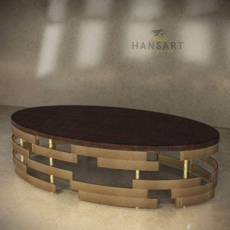 HANSART - Add a touch of elegance and sophistication to your living space with this stunning Luxury Modern Oval Coffee Table. Featuring a sleek dark wood finish top and an eye-catching geometric gold metal base, this statement piece effortlessly blends contemporary style with timeless charm.