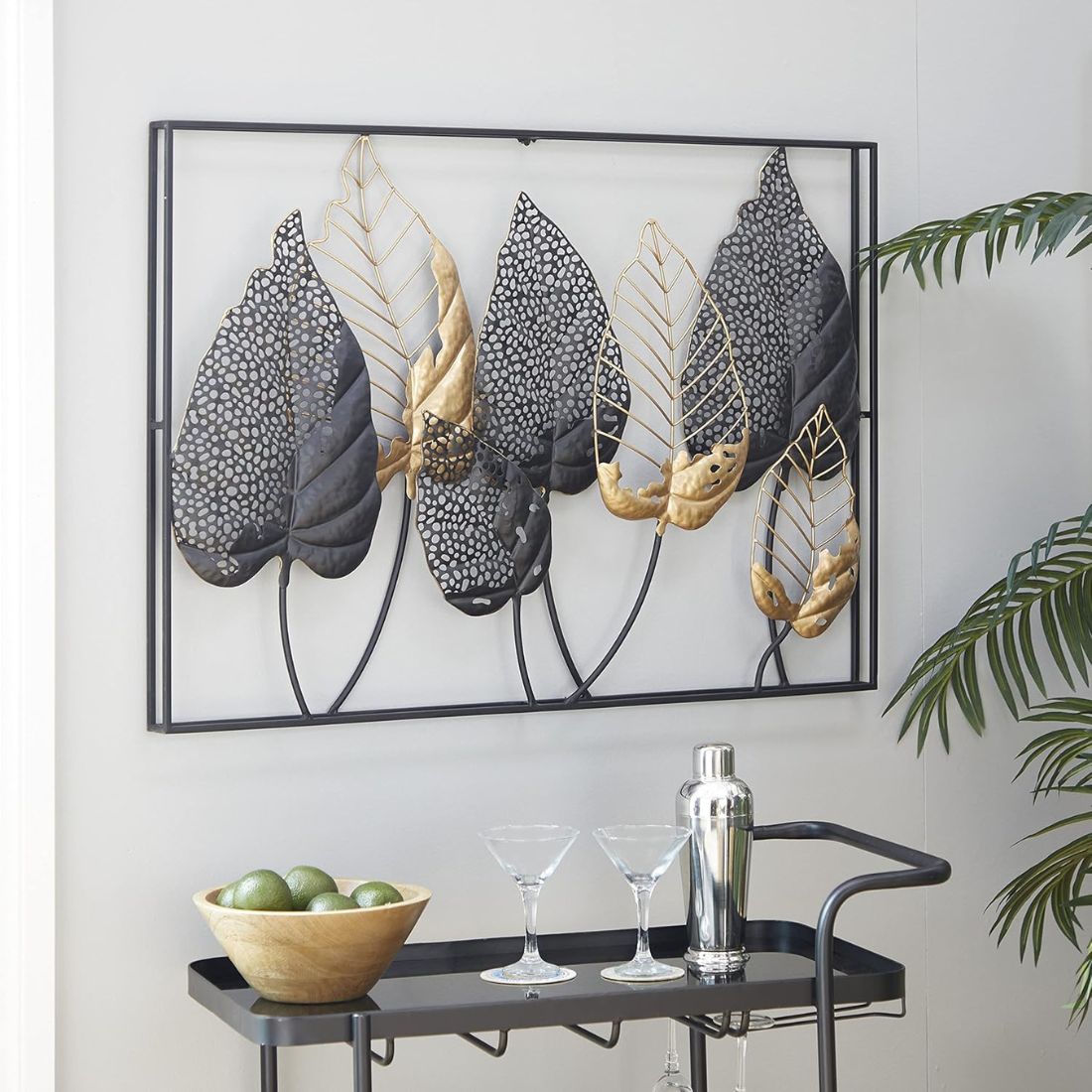 Add a touch of luxury and serenity to your space with this stunning black and gold double frame metal wall art, featuring intricate leaf accents. The sleek black frame is beautifully complemented by golden leaves, creating a striking contrast that adds depth and visual interest. Perfect for bringing a sense of sophistication and calm to any room.  Details:  - Size: 37 x 25 inches (94 x 63 cm) - Material: Metal