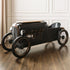 Vintage-style toy car on a wooden floor with a neutral background