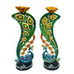 Pair of decorative vases with peacock designs on a white background
