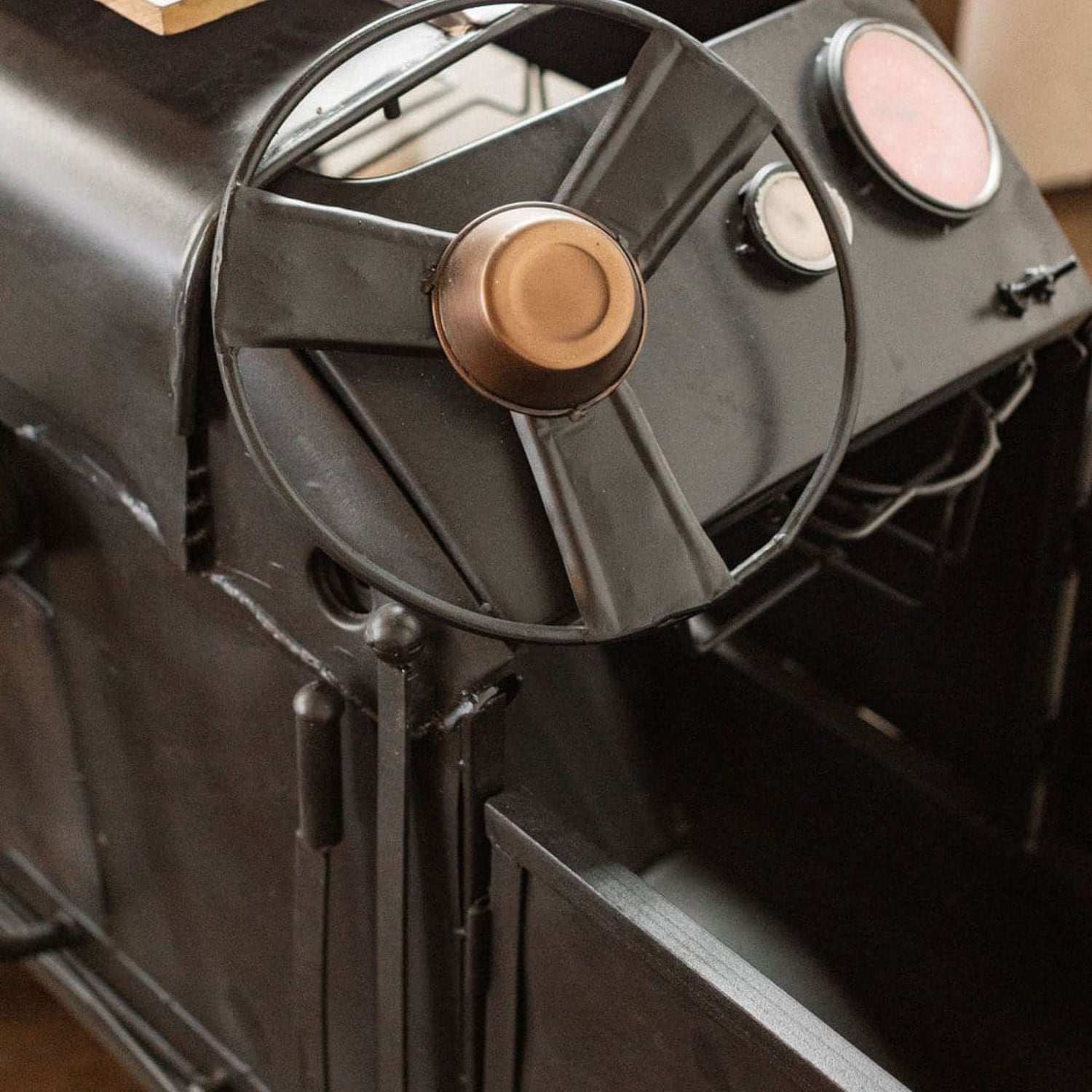 Close-up of a vintage-style suitcase with metallic accents
