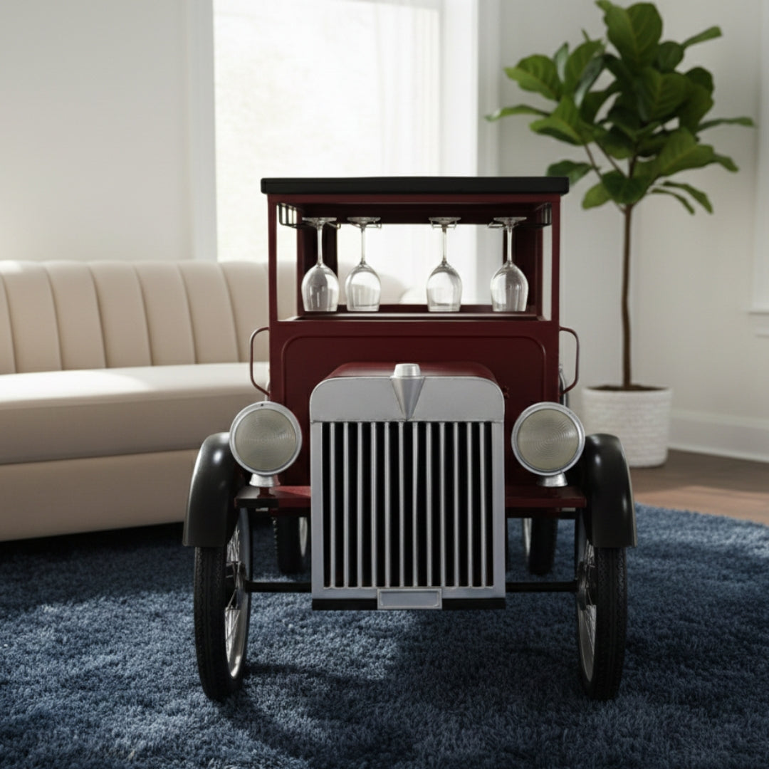 Vintage car-shaped bar cart with wine glasses in a living room setting