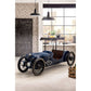 Vintage-style blue car in a modern interior setting with a chalkboard wall and bar area.