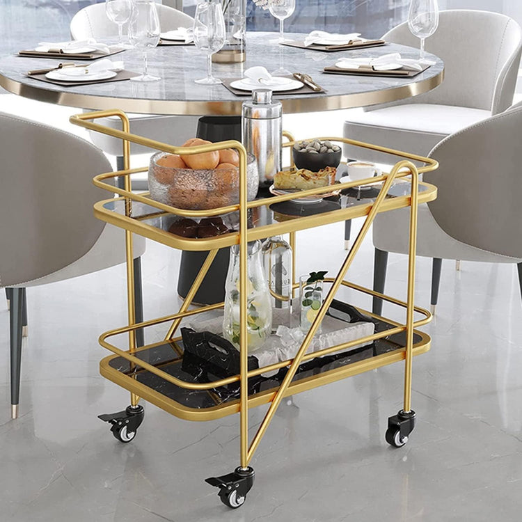 Gold bar cart with food items in a modern dining setting
