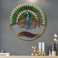 Decorative wall art of a peacock with a gold frame on a gray wall.