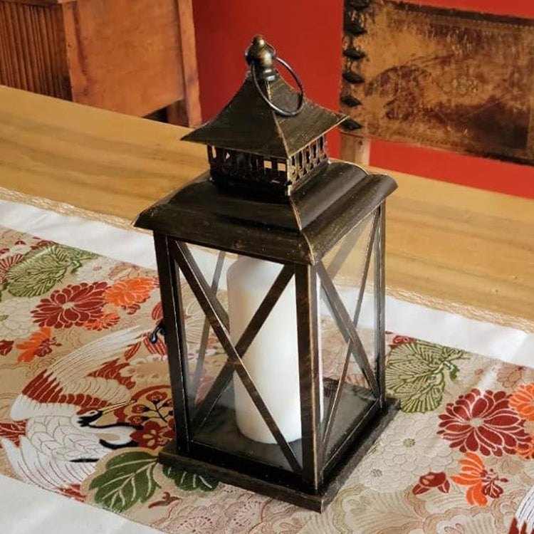 Vintage Black Candle Lantern Holder for Indoor Outdoor Decoration-Hansart-Hansart, Add a touch of vintage charm and warm ambiance to your space with this Rustic Black Metal Candle Lantern. Crafted from durable metal with clear glass panels, this lantern features an elegant cross-frame design and distressed finish, making it a perfect addition to both indoor and outdoor decor. Place a real or flameless LED candle inside to create a cozy glow on your patio, living room, garden, or during special events like w