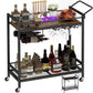 Bar cart with liquor bottles, glasses, and decor on a white background