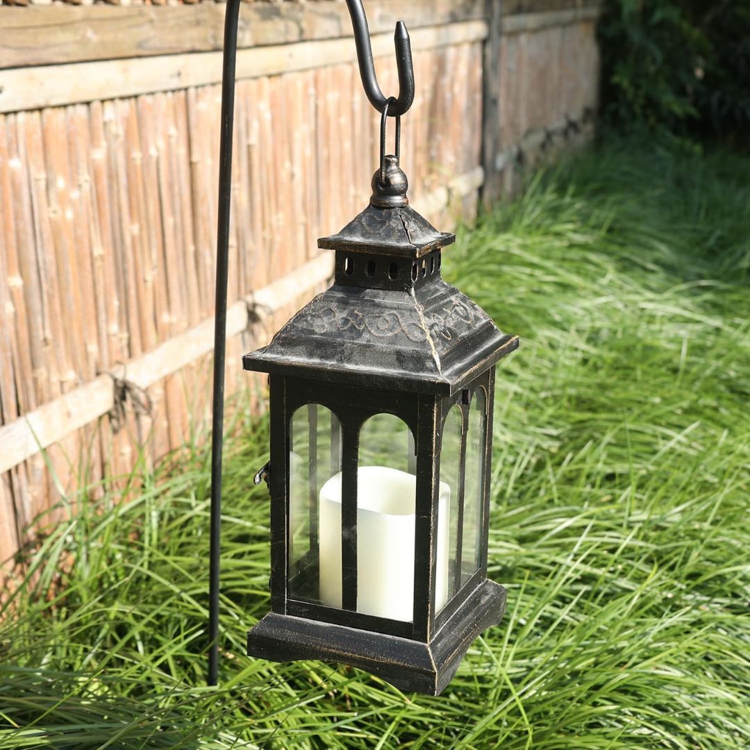 Vintage Black Metal Lantern Candle Holder for Home and Garden Decor-Hansart-Hansart, Add a touch of timeless elegance to your indoor or outdoor space with this Vintage Black Metal Lantern. Crafted from premium metal and clear glass panels, this lantern beautifully showcases the flickering glow of candles, whether real or flameless LED. Its windproof design ensures a steady flame, making it ideal for patios, gardens, weddings, or cozy indoor settings. With its antique finish and versatile style, this lantern